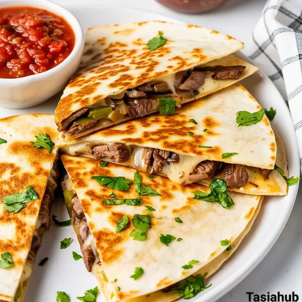 A photo of Philly cheesesteak Quesadilla